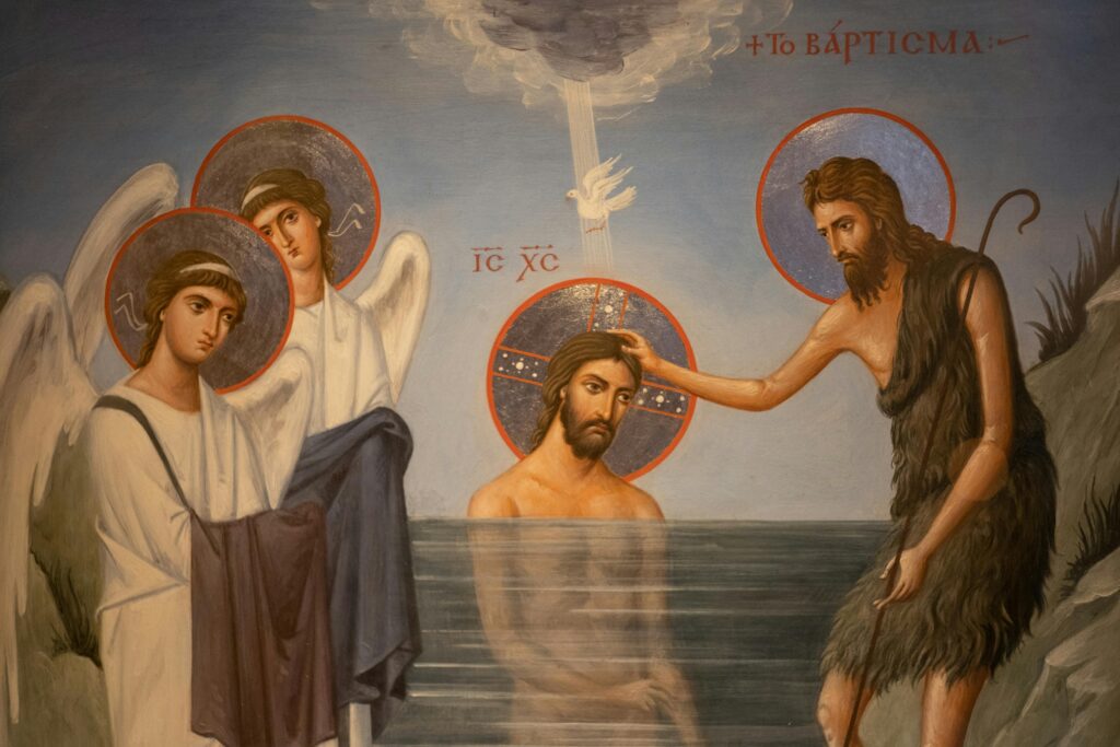 Illustrated scene from a religious painting depicting the baptism of Jesus Christ.